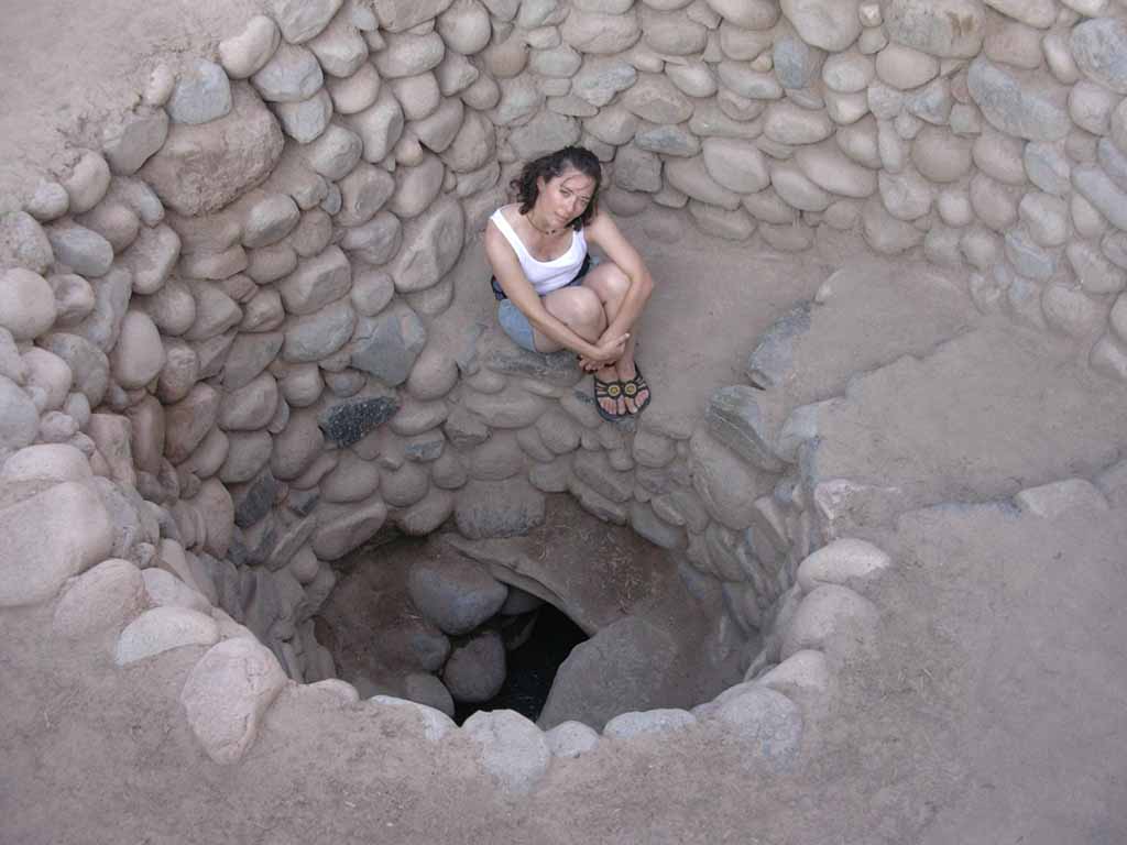 Nazca - Ingrid in a maintenance shaft of an ancient aqueduct